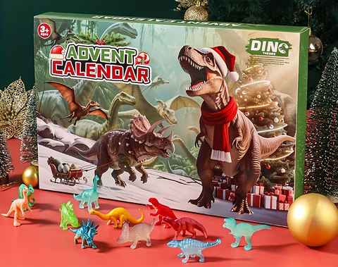 Adventskalender med dinosaurier: grön ask med jultryck och små plastdinosaurier i olika färger utlagda framför